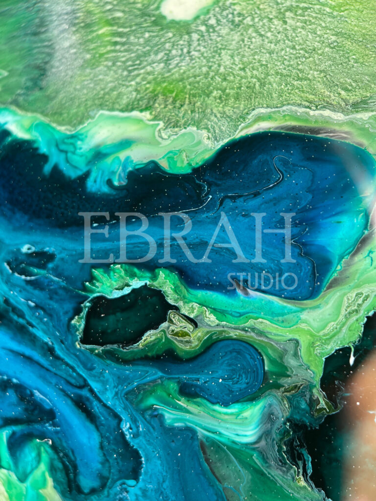 macro shot of alcohol ink blue green