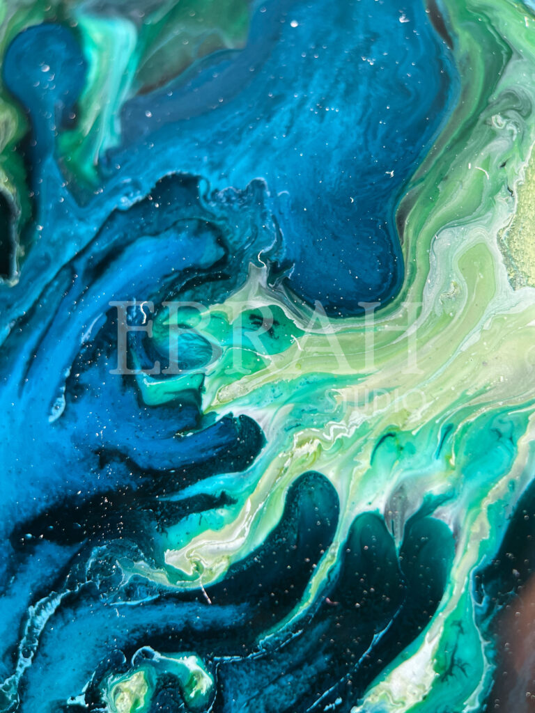 macro shot of alcohol ink blue green