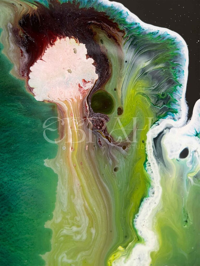 macro shot of alcohol ink blue green