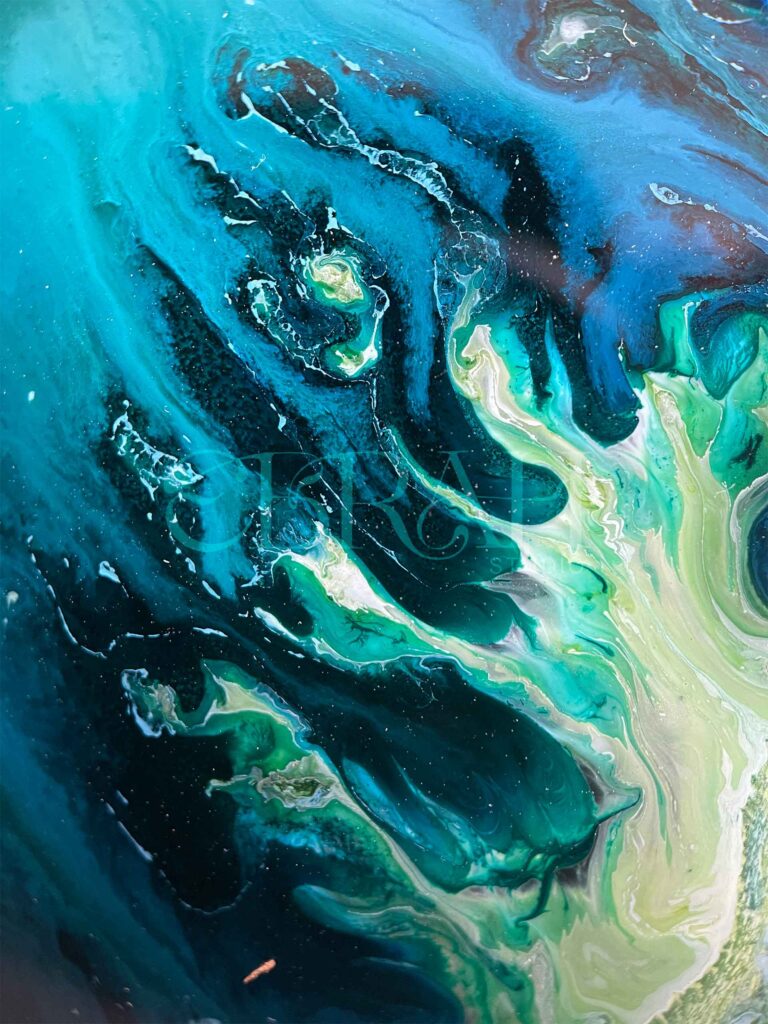 macro shot of alcohol ink blue green